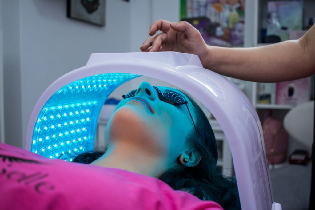pexels-photo-4207236-4207236 Unrecognizable woman with dark hair with pierced ears lying under ultraviolet lamp while visiting contemporary clinic and spending time in modern salon